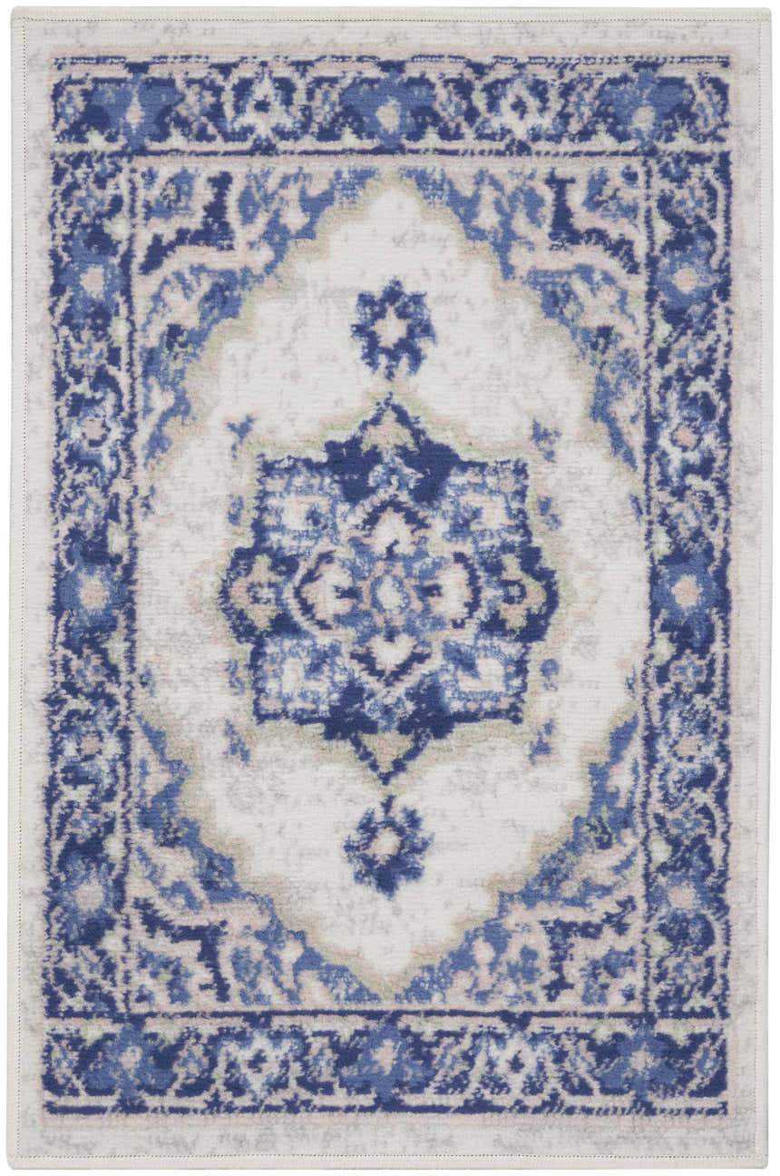 Close-up of Nourison Whimsicle Ivory Blue Farmhouse rug, featuring a traditional floral design with chestnut accents.