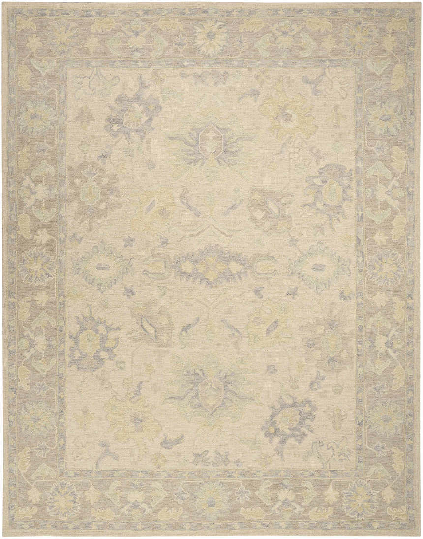 Close-up of the Nourison Maison Ivory Taupe Vintage Area Rug. Handmade pile rug with floral pattern and taupe border.