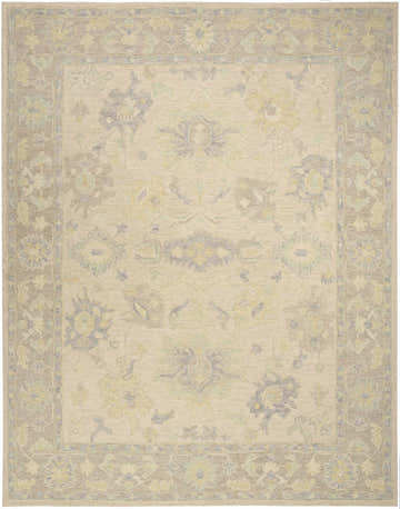 Close-up of the Nourison Maison Ivory Taupe Vintage Area Rug. Handmade pile rug with floral pattern and taupe border.
