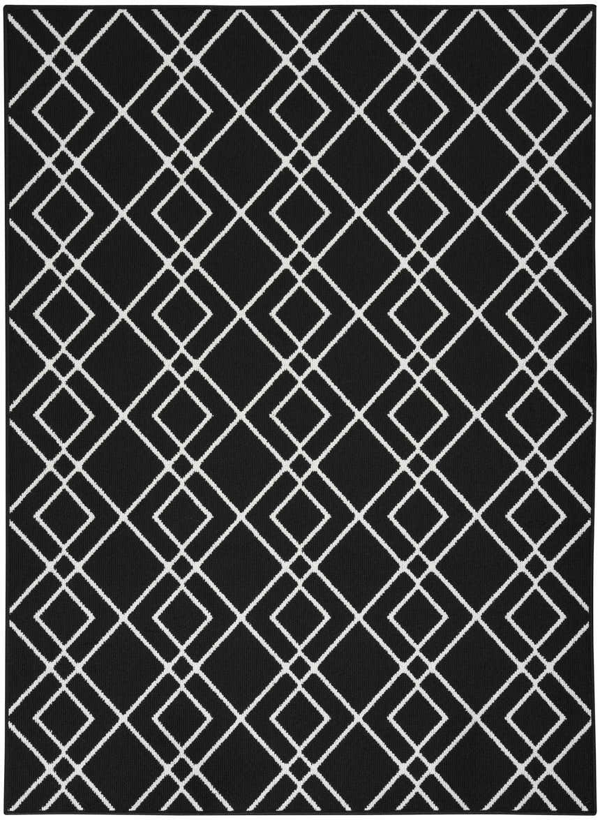 Close-up of the Nourison Modern Lines Black rug, featuring a geometric diamond pattern in white on a black background.