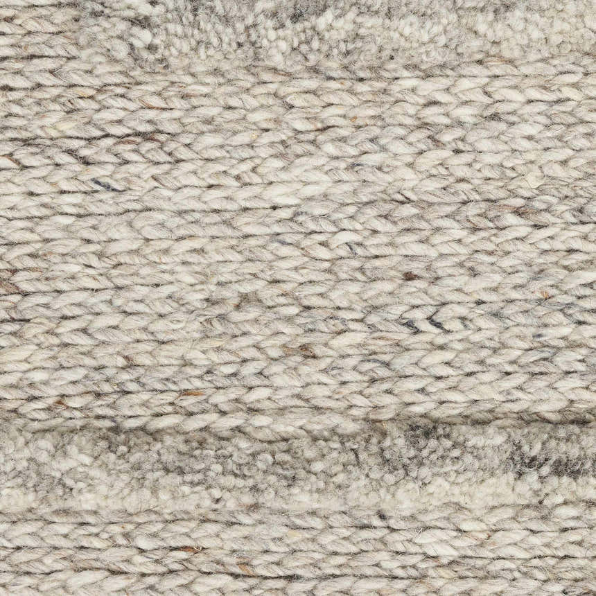 Close-up of the Calvin Klein CK045 Impressions Silver rug showing its chunky wool knit and silver gray color.