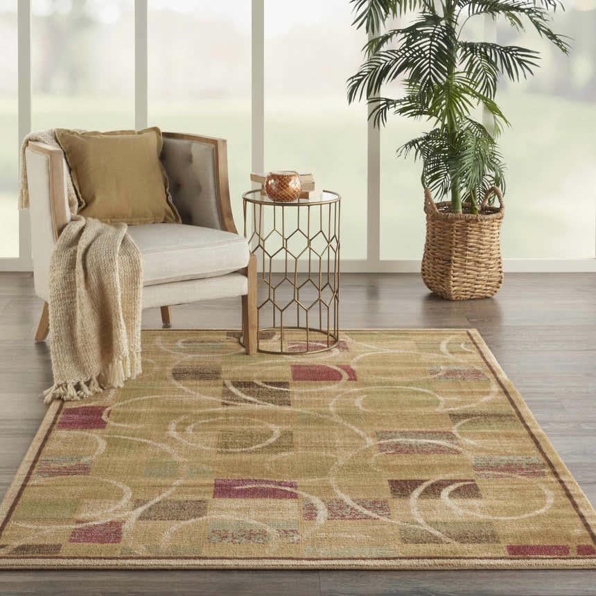 Living room scene with a Nourison Expressions Beige rug, chair, side table, and plant. Modern style.