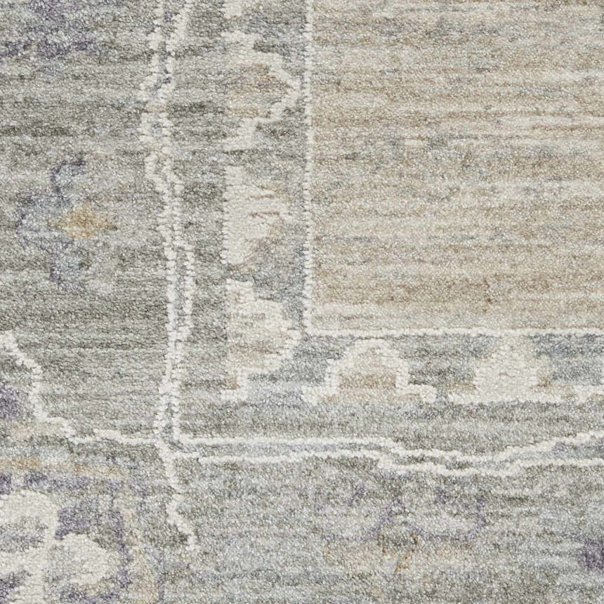 Close-up of the Nourison Infinite Light Grey Vintage rug, showing the texture and subtle, faded pattern.