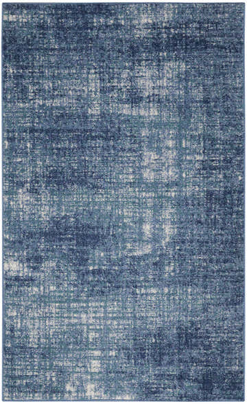 Close-up of Calvin Klein River Flow Teal Ivory Blue Rug. Modern design with a distressed pattern and cool-toned colors.