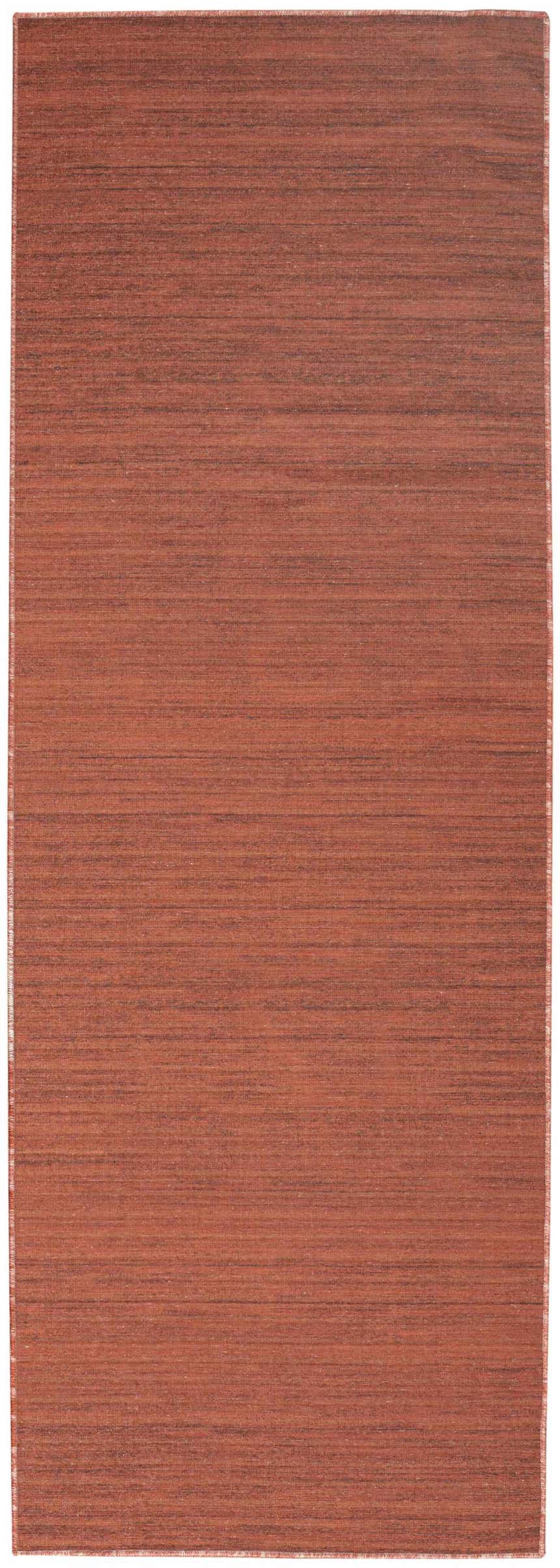 Close-up of Nourison Essentials Brick Modern Indoor Washable Area Rug. Brick red color with subtle horizontal texture.