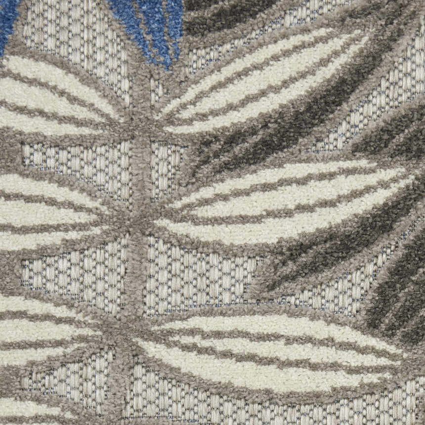 Close-up of the Nourison Aloha Grey Blue Tropical Area Rug showing the leaf pattern and texture.