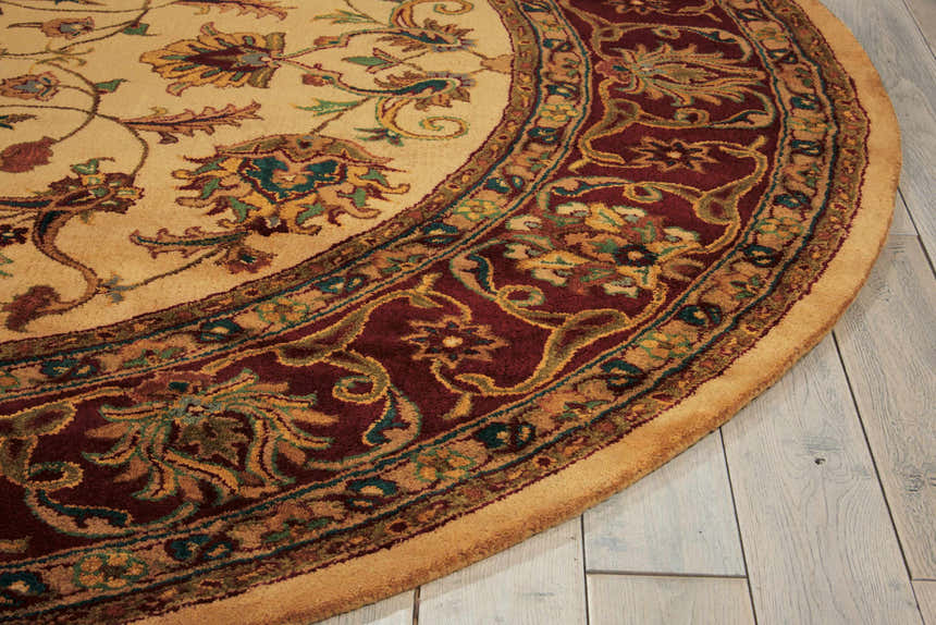Close-up of the round Nourison Jaipur Light Gold rug, showcasing its floral pattern and wool texture.