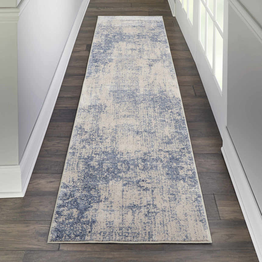 Hallway with Nourison Silky Textures Ivory/Blue runner rug on dark wood floor, white walls and trim.