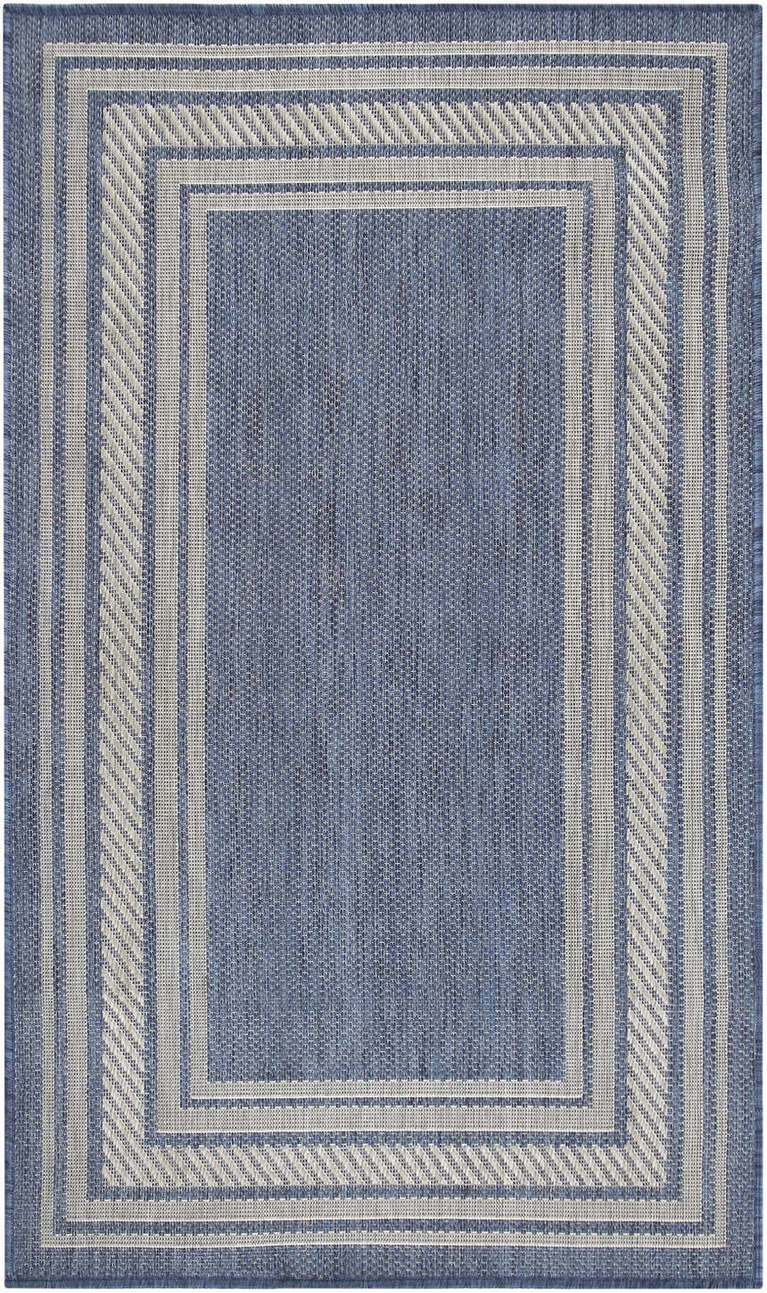Close-up of the Nourison Horizon Denim Area Rug, a modern design with a blue base and a geometric border pattern.