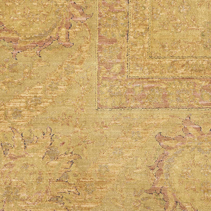 Close-up of the gold Nourison Luxurious Vintage Rug. Features a subtle vintage pattern and textured weave.
