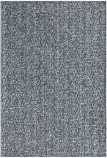 Close-up of the Nourison Tulum Denim Outdoor Area Rug showing its textured, herringbone weave pattern in shades of blue.