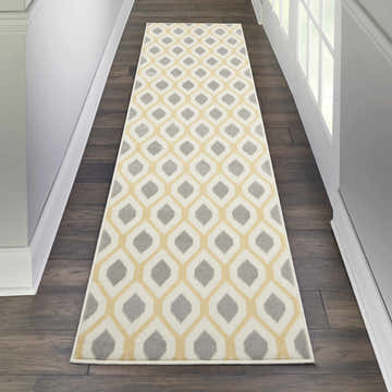 Hallway with Nourison Grafix White runner rug. Contemporary style, off-white, gray, and yellow geometric pattern.