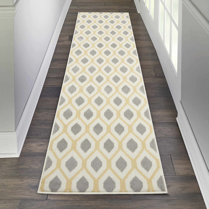 Hallway with Nourison Grafix White runner rug. Contemporary style, off-white, gray, and yellow geometric pattern.