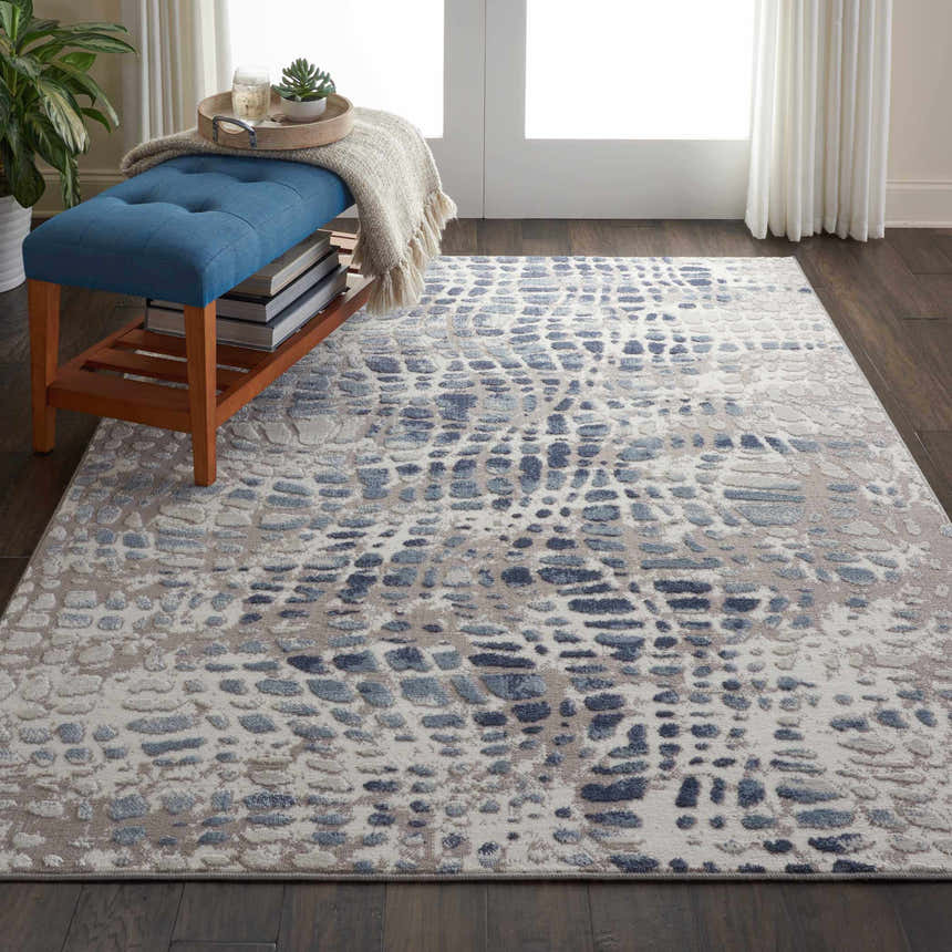 Entryway with Nourison Urban Decor Ivory/Grey rug, blue bench, wood floors, and sheer curtains. Modern, inviting style.