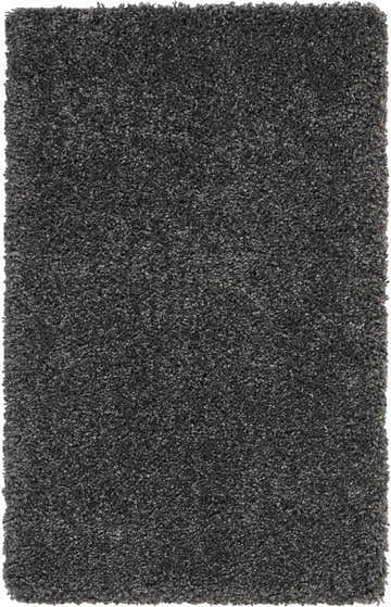 Close-up of the plush texture of the Nourison Malibu Shag Dark Grey rug. Soft, dense pile in medium gray tones.