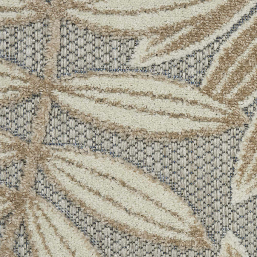 Close-up of Nourison Aloha Natural Tropical Area Rug showing leaf pattern, texture, and brick red color.