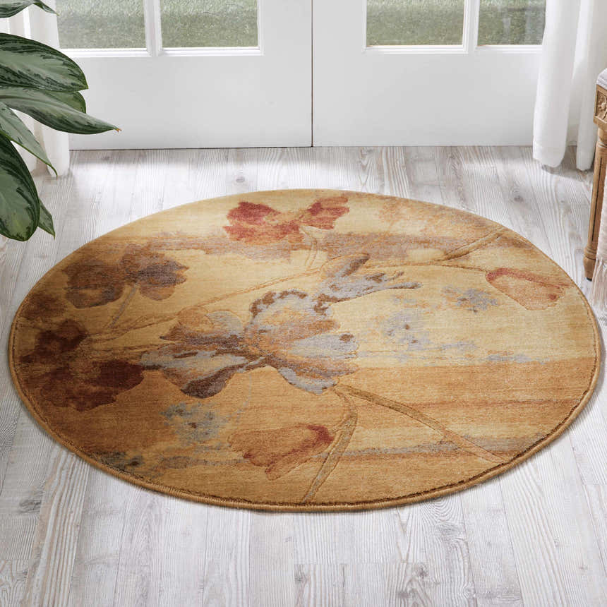 Round Nourison Somerset Beige rug with floral design in a bright room with wood floors and white french doors.