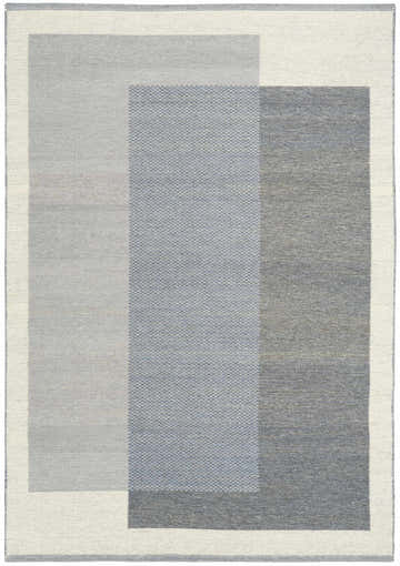 Close-up of Nourison Copenhagen Ivory Blue rug. Mid-century modern design with geometric blocks in shades of gray.