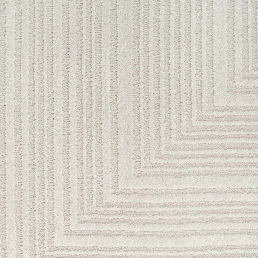 Close-up of the Calvin Klein CK024 Irradiant Ivory rug, featuring a subtle geometric pattern and soft, textured pile.
