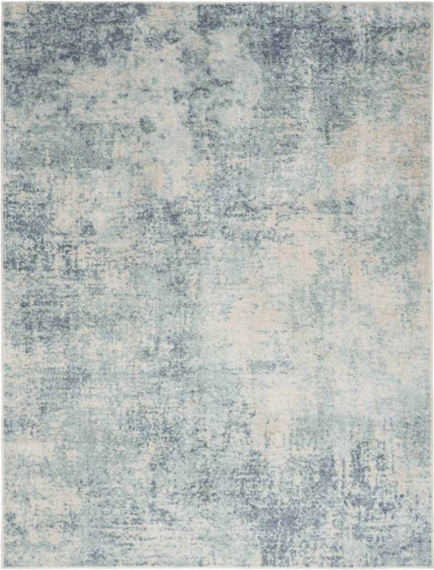 Close-up of the Nourison Astra Blue Ivory Rug. Abstract pattern in shades of blue, ivory, and chestnut.