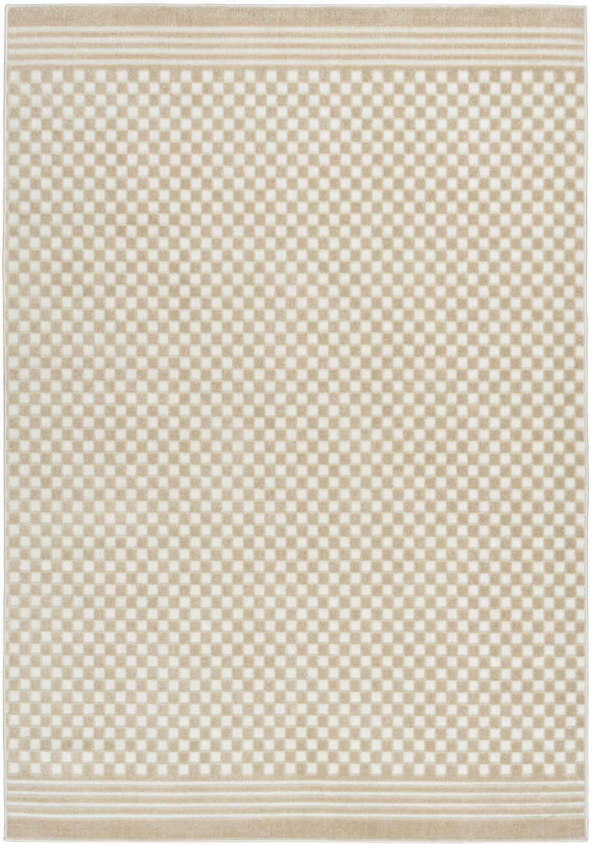 Close-up of Nourison Care Free Beige rug with a subtle checkerboard pattern and striped border. Mid-century modern style.