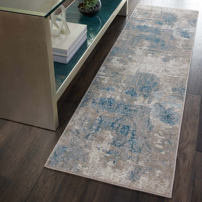 Entryway with Nourison Karma Ivory/Light Blue runner rug, vintage style, on dark wood floor next to console table.