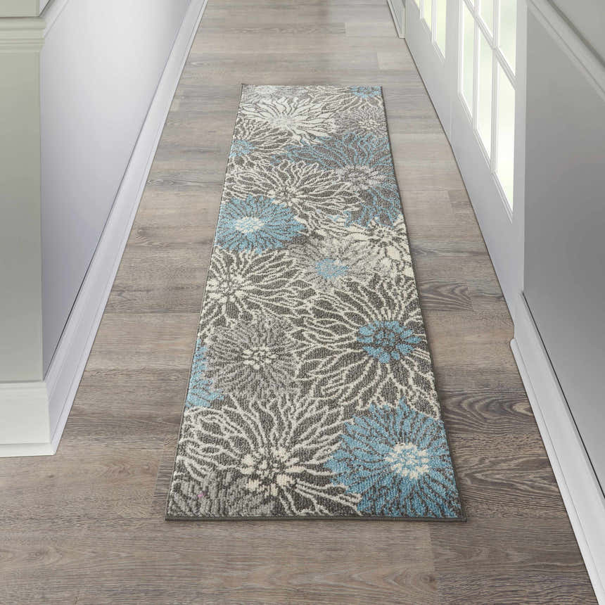 Hallway with Nourison Passion Charcoal Blue runner rug, floral pattern, taupe wood floor.