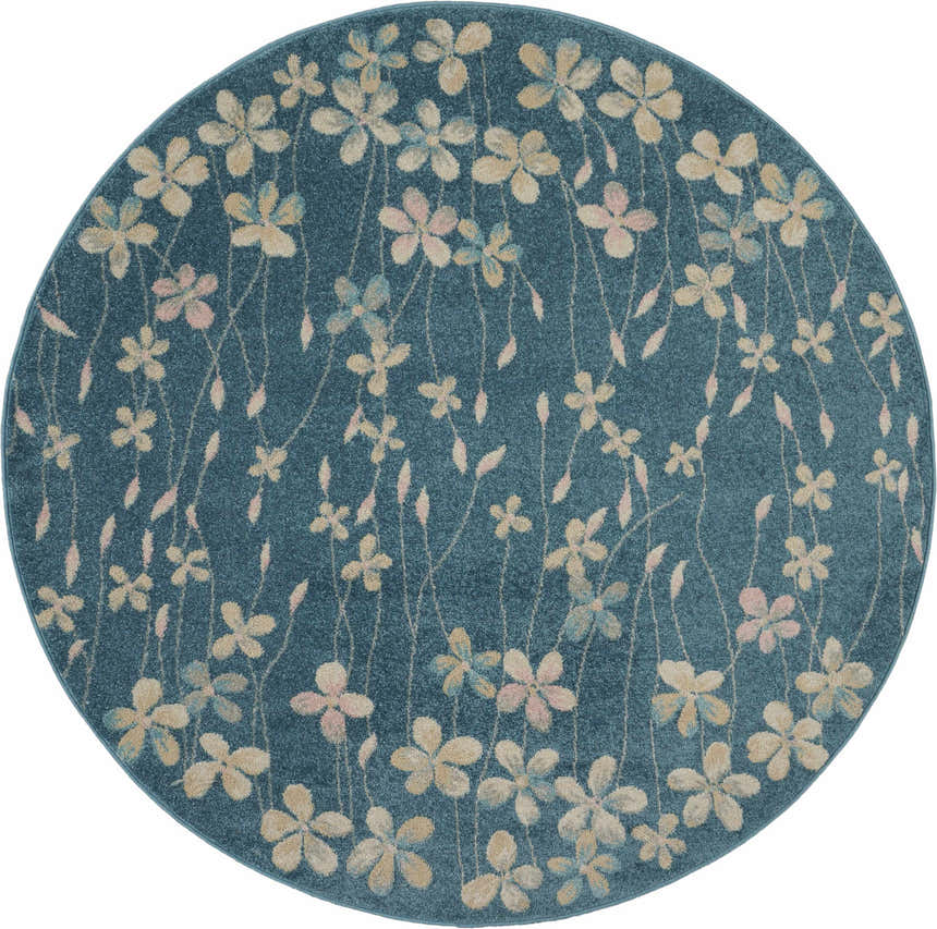 Close-up of round Nourison Tranquil Turquoise rug. Aqua rug with a floral pattern in beige, pink, and blue.