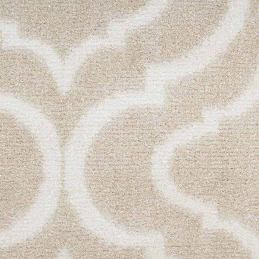 Close up of the beige Nourison Jubilant rug featuring a contemporary geometric pattern and soft texture.