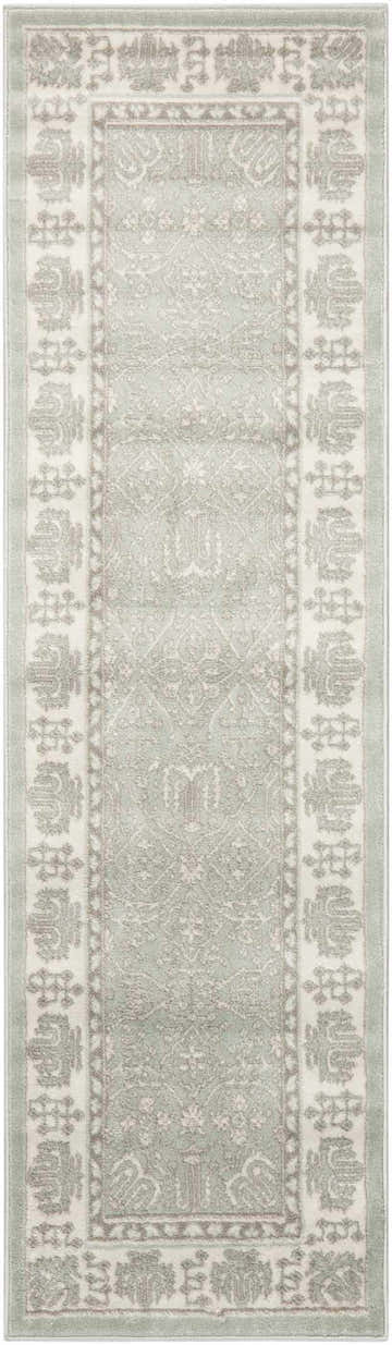 Close-up of a Spa-colored Nourison Euphoria Vintage runner rug with a traditional, ornate pattern.