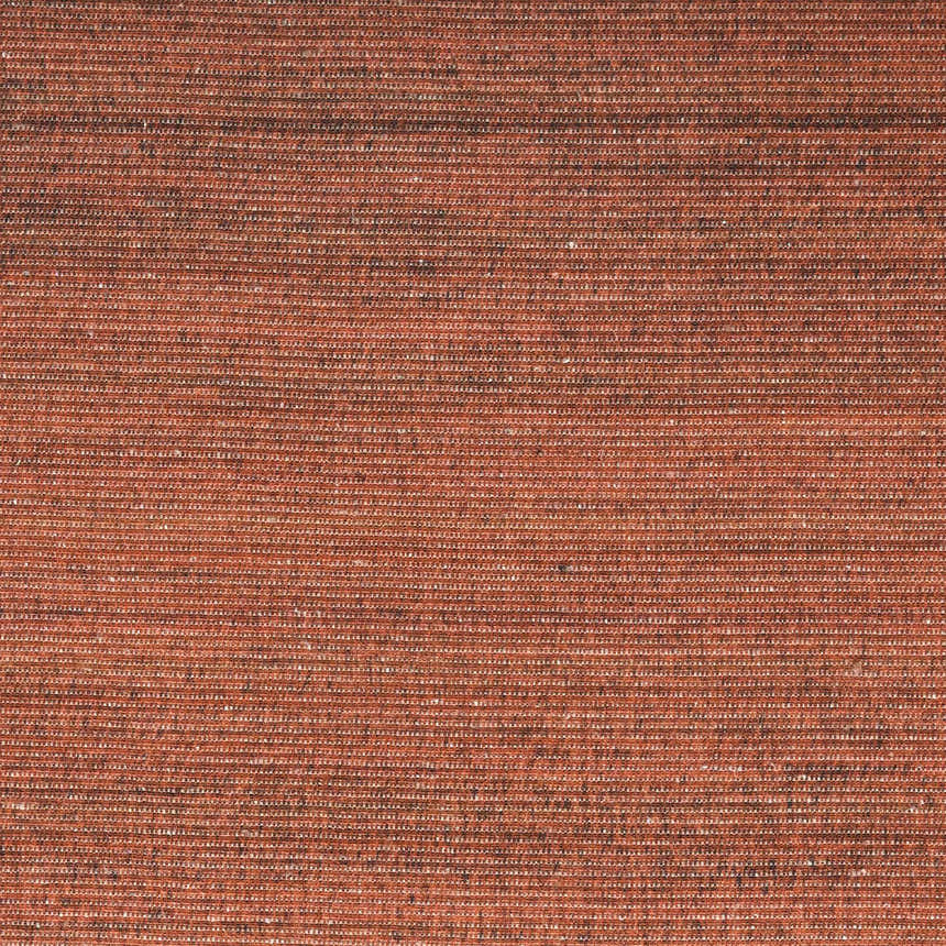 Close-up of the brick red Nourison Essentials Modern Area Rug, showing texture and machine-made construction.