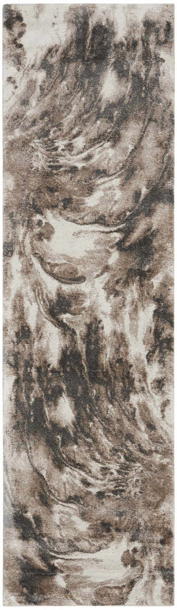 Close-up of the Nourison American Manor rug. Ivory and mocha tones create a modern, swirling pattern.