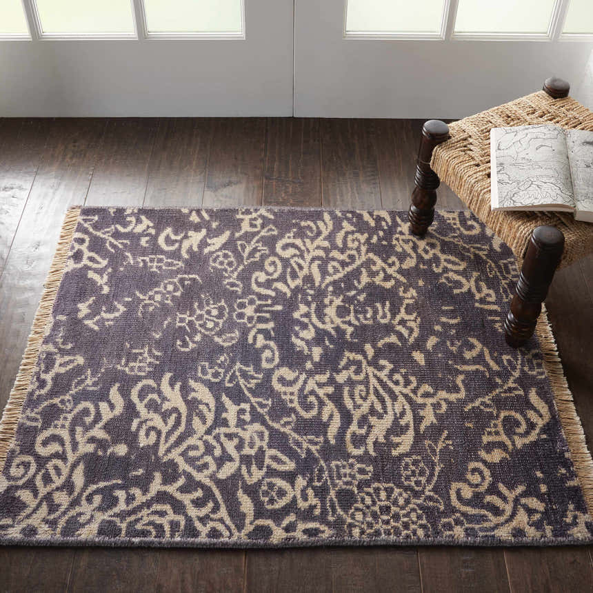 Room scene with Nourison Aldora Royal Vintage rug in royal blue with a light floral pattern on dark wood floor.