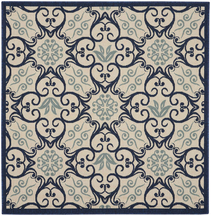 Close-up of the Nourison Caribbean Ivory Navy rug featuring a contemporary floral and scroll pattern.