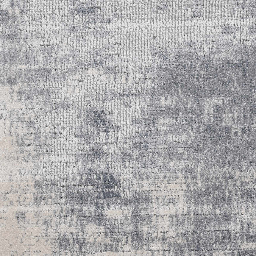 Close-up of the Nourison Rustic Textures Blue Ivory area rug, showing its textured weave and subtle modern pattern.