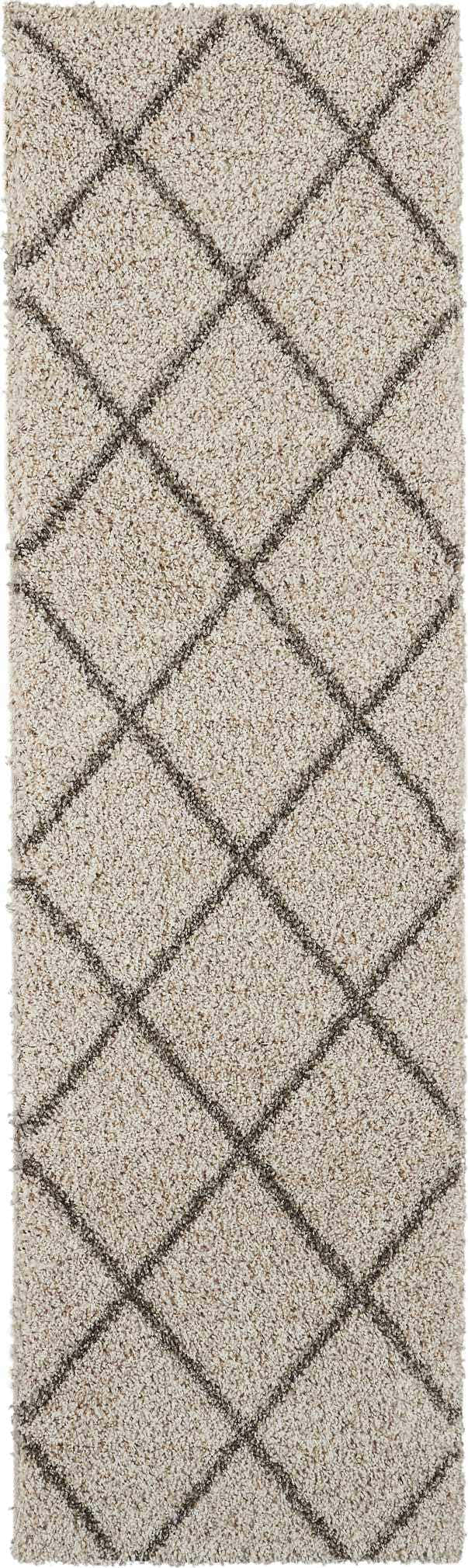 Close-up of Nourison Brisbane Cream Shag Indoor Area Rug with a diamond pattern and soft, plush texture.