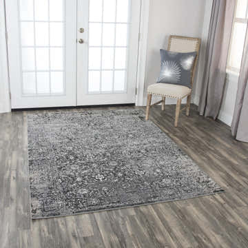 Entryway with Rizzy EN7272 rug in black, red, ivory, and gray. Farmhouse style with chair and white doors. Roomscene-Rectangle