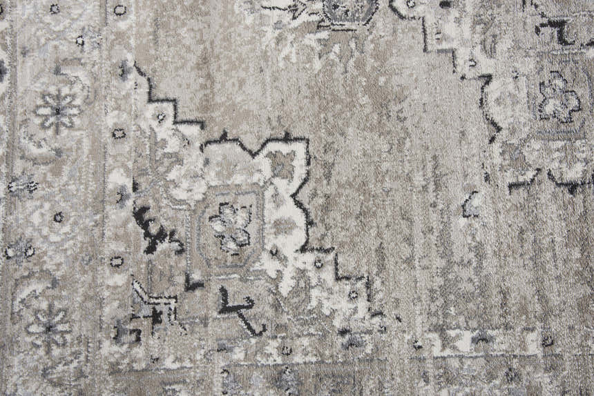 Close-up of the Rizzy EN7351 area rug showing traditional farmhouse design, neutral colors, and soft polypropylene texture. Texture