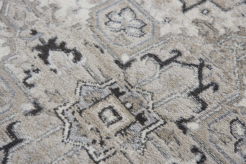 Close-up of the Rizzy EN7351 area rug showing its traditional pattern, burnt orange and gray colors, and soft polypropylene texture. Texture