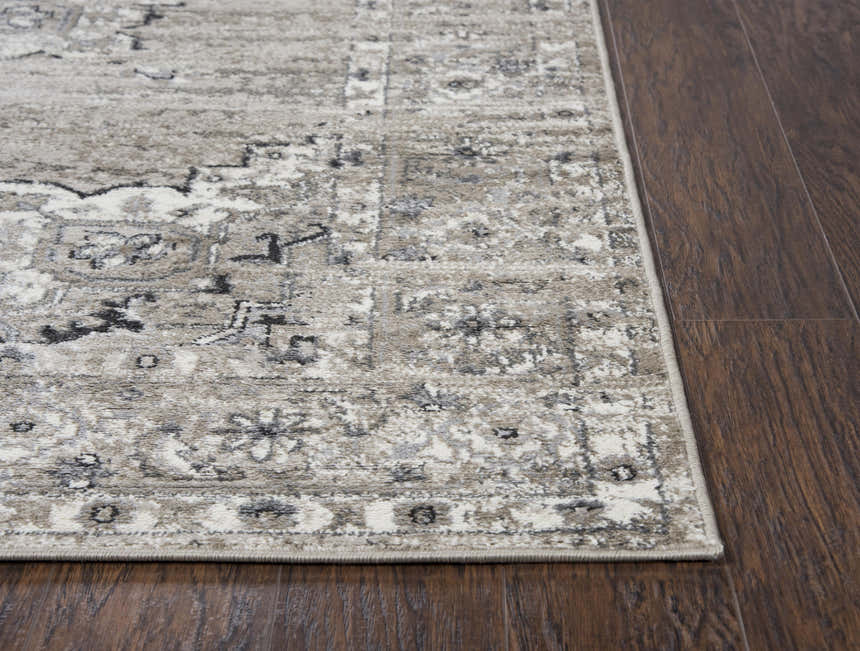 Close-up of Rizzy EN7351 area rug showing traditional farmhouse pattern and texture on dark wood floor. Corner