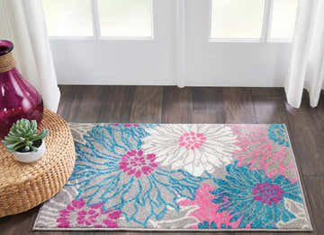 Entryway with Nourison Passion Grey rug featuring floral pattern in pink, blue, and white on a grey background.