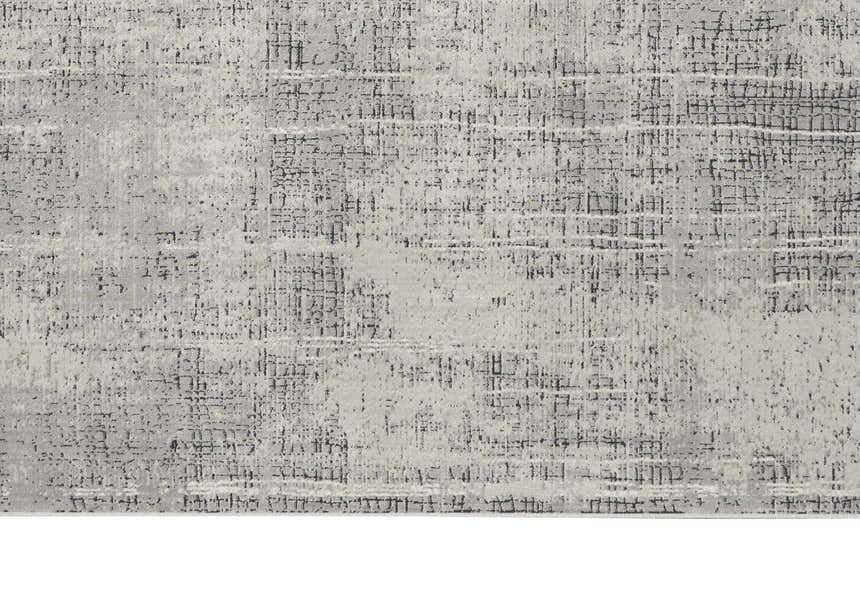 Close-up of the Calvin Klein CK970 Vapor Grey Ivory rug. Modern design with chestnut accents and subtle texture.