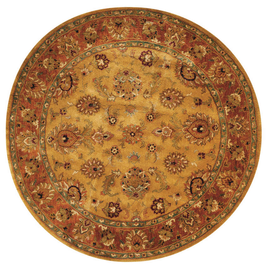 Close-up of round Nourison Jaipur Gold rug; gold, rust, and green floral pattern. Handmade wool rug.