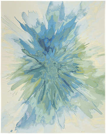 Close-up of the Nourison Color Splash Ivory Blue rug, featuring a modern abstract burst pattern in shades of blue, green, and ivory.