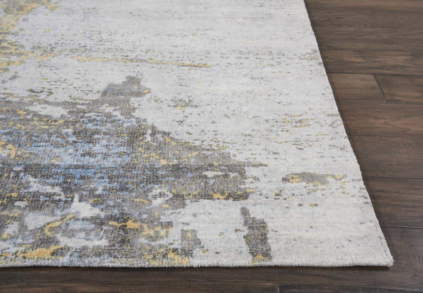 Close-up of Nourison Safari Dreams Ivory Gold Painterly Rug showing painterly chestnut, gold, and blue design.