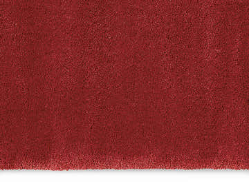 Close-up of the plush texture of the Calvin Klein Brooklyn Burgundy shag rug.
