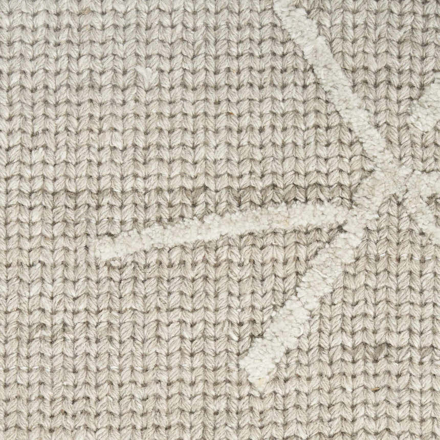 Close-up of the Calvin Klein CK044 Wander Taupe rug showing the wool and rayon blend and ivory geometric pattern.