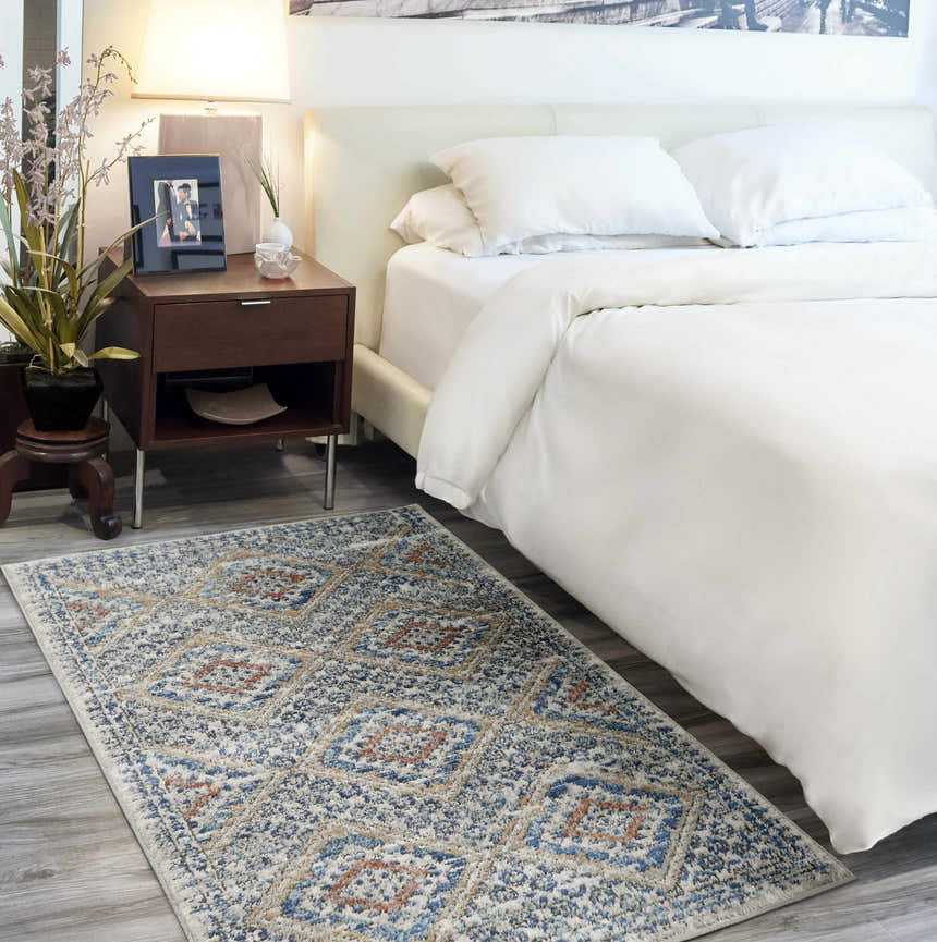 Bedroom scene with Nourison Quarry Blue Ivory Southwestern Indoor Area Rug runner by a bed.