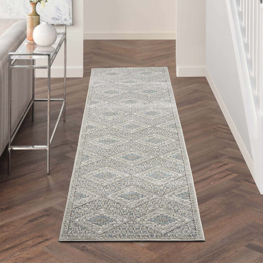 Hallway with Nourison Quarry Grey Ivory Blue Southwestern Runner Rug on dark wood floors.