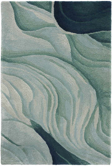 Close-up of the Nourison Prismatic Silver Green rug. Abstract, swirling pattern in shades of silver, green, and navy. Handmade texture.